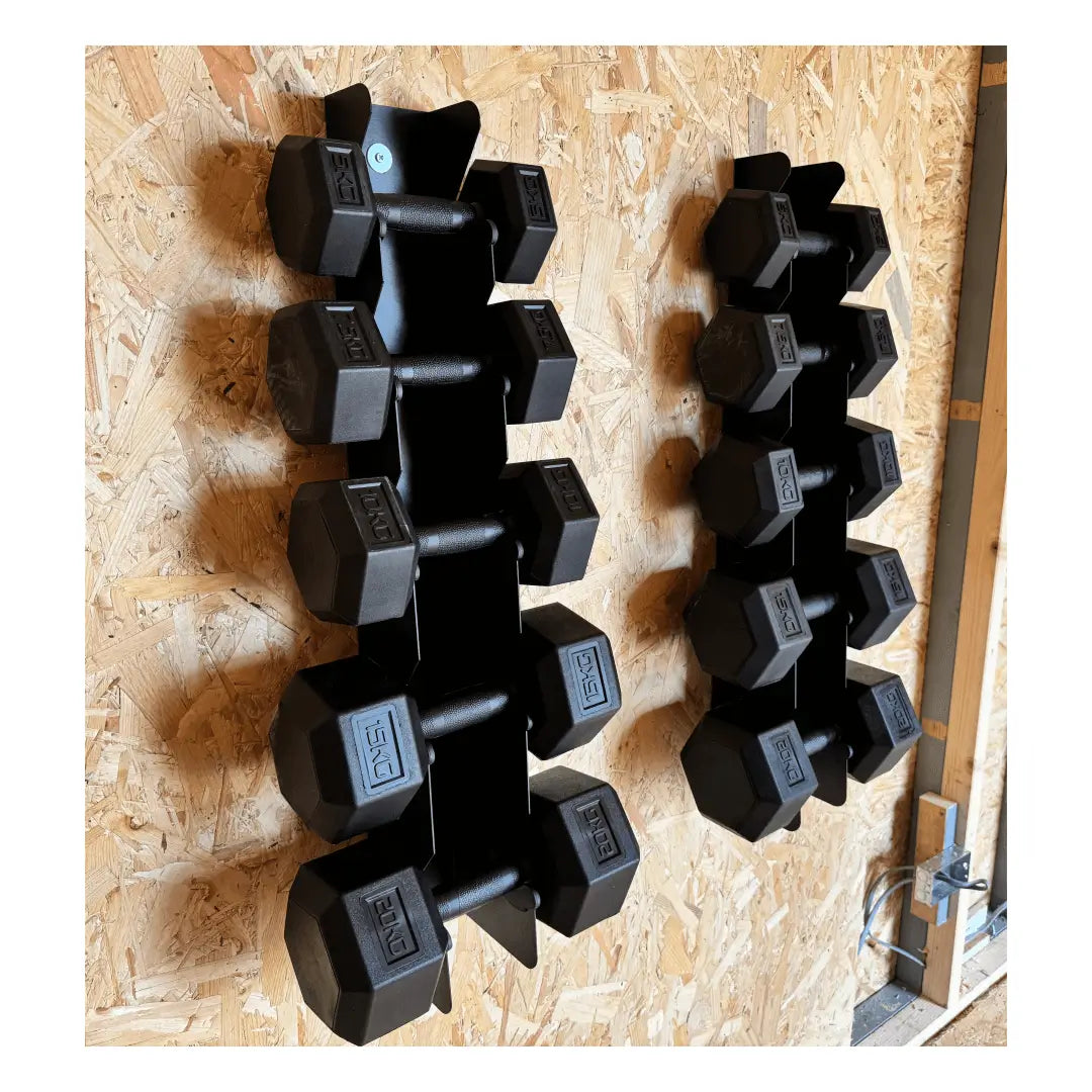 Wall mounted black hex dumbbell set with rubber coating on wooden wall rack.