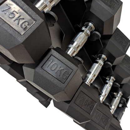 Set of black rubber hex dumbbells with chrome handles neatly arranged on a black storage rack, weights from 2.