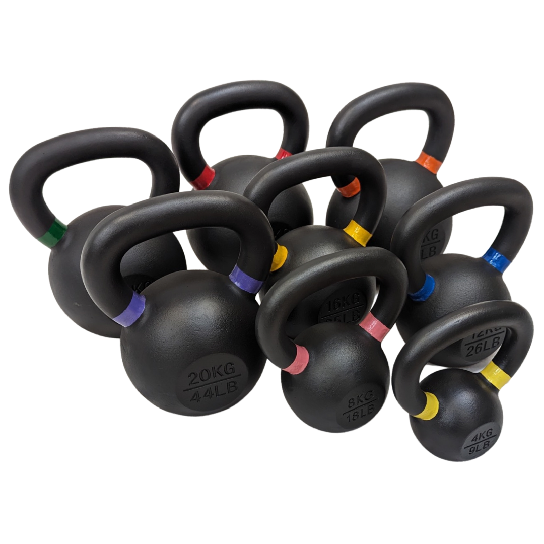 Set of powder-coated black cast iron kettlebells with color-coded handles for weight identification, arranged in descending.