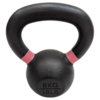 Black cast iron kettlebell with powder-coated handle, marked 8kg/18lb with pink accent bands.