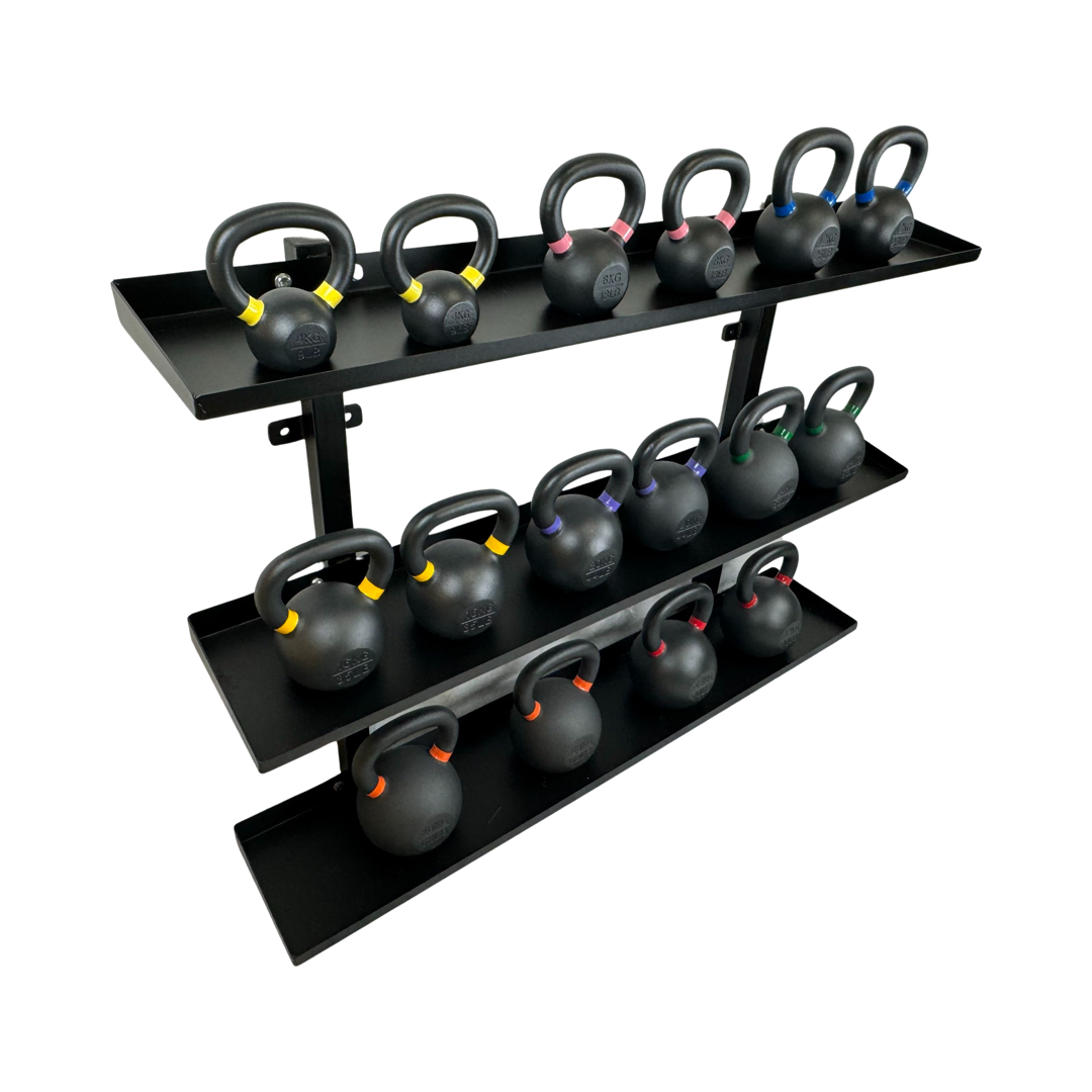 Black wall-mounted steel kettlebell rack with three shelves holding kettlebells of varying weights marked by colored bands.