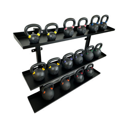 Black wall-mounted steel kettlebell rack with three shelves holding kettlebells of varying weights marked by colored bands.